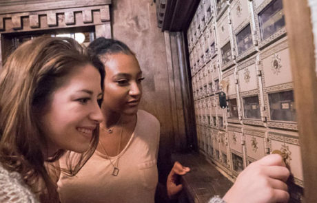 woman opening mailbox