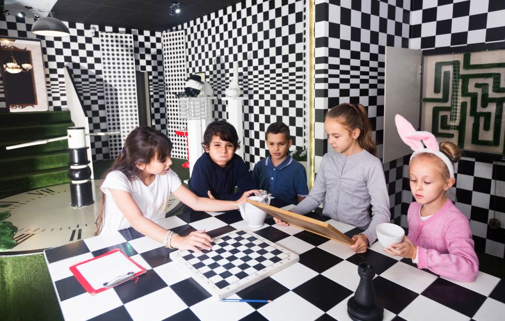 Children play in the chess quest room