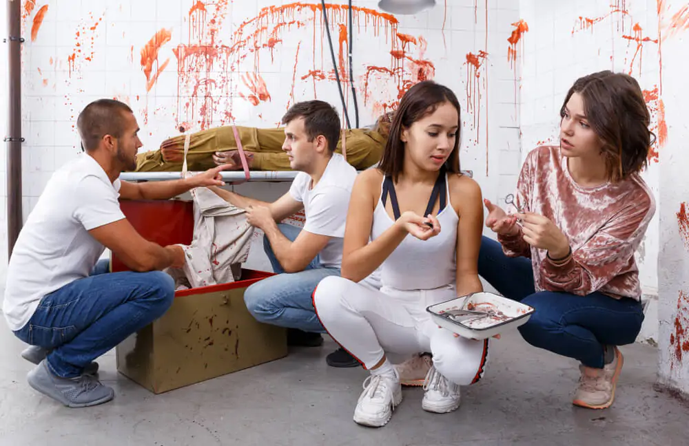 Group of young adults trying to get out of escape room