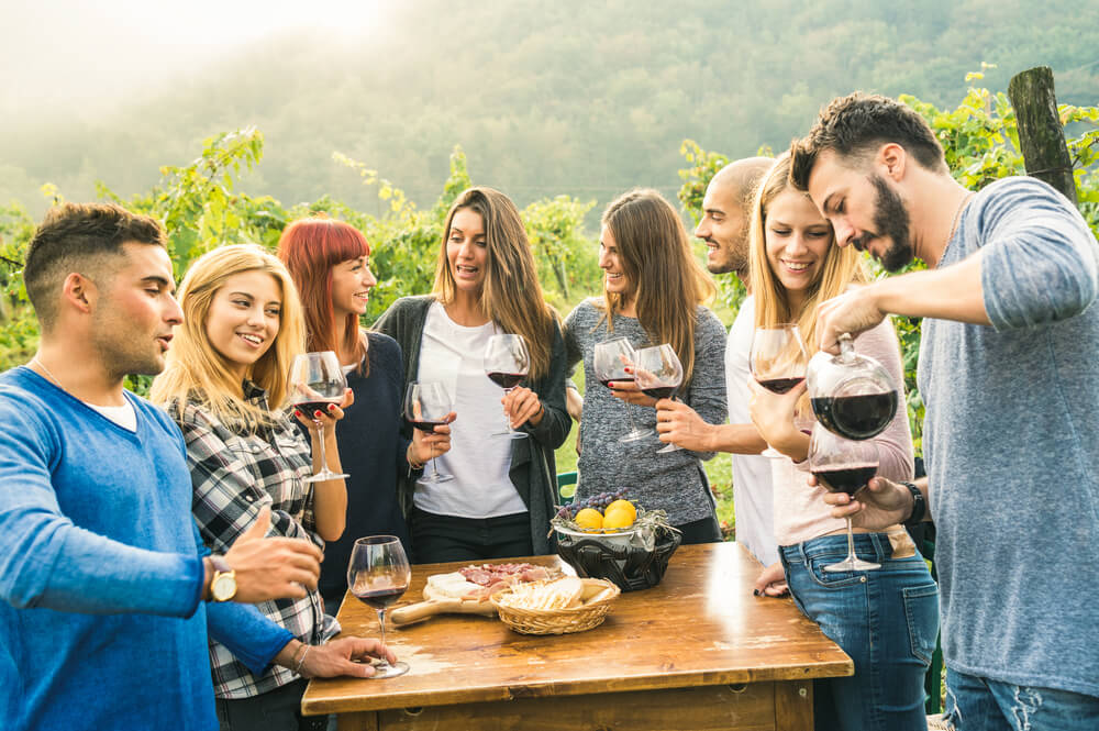 Team Building Activities in Denver - friends having fun outdoors drinking red wine